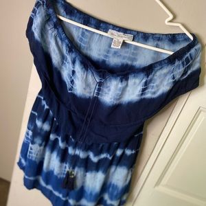 A blue tie-dye off the shoulder romper. This romper is great for the summer!